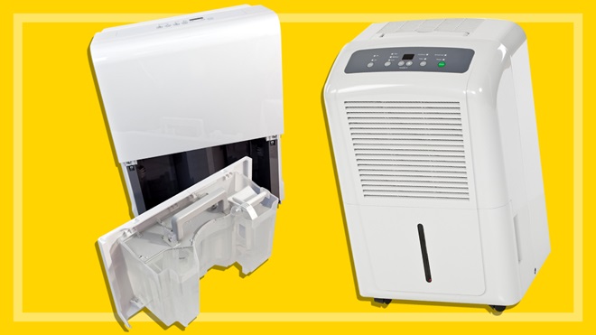 two white dehumidifiers on a yellow background